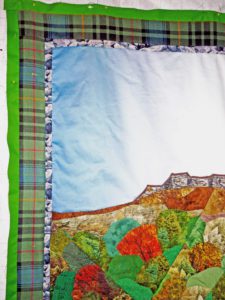 Bordering a fractured landscape quilt of Stirling Castle with the surrounding foliage and rock face below the castle