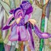 Quilted purple iris using fifty small pieces of fabric