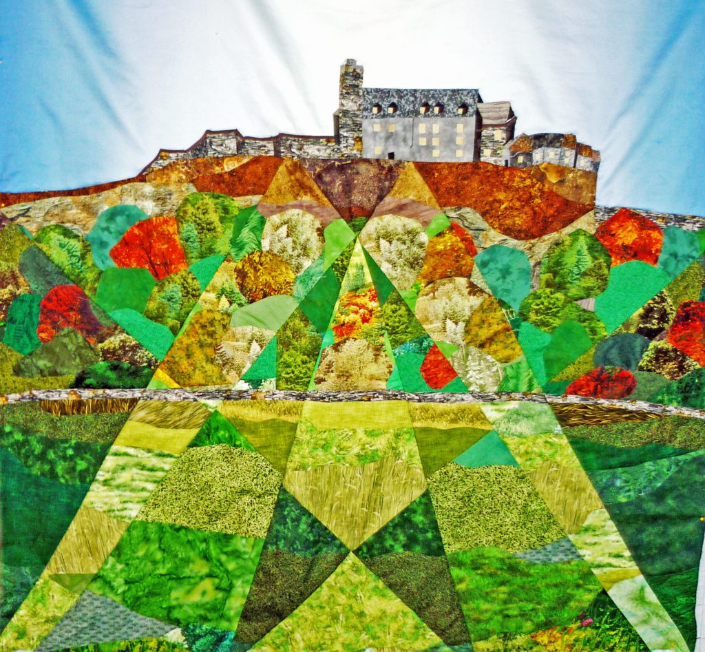 Fractured landscape quilt of Stirling Castle in the early stages of design prior to filling in the details with quilting and top-stitching