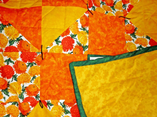 Lap Quilt of yellow and orange chrysanthemum fabrics