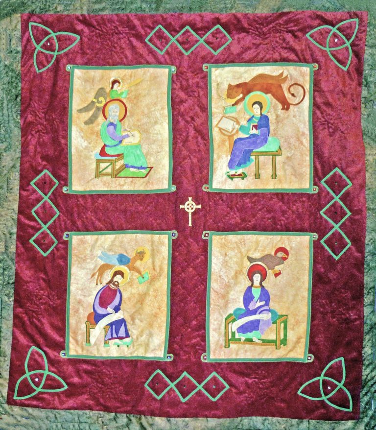 Quilt of the four evangelists from the Lindisfarne Gospels on a burgundy background framed in a Celtic knot design