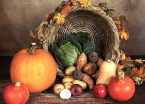 Cornucopia filled with autumn fruits and vegetables