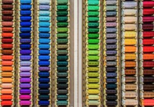 Row after row of threads in a rainbow of colours