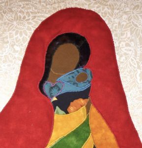 Madonna and Child of colour quilted with brightly hued fabrics