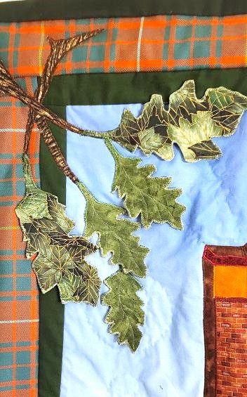 3-D quilted leaves on a tartan background