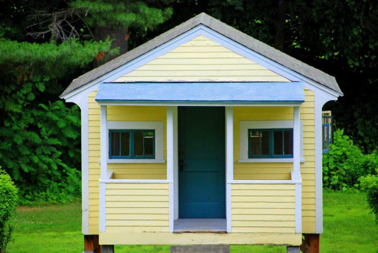 Cute yellow house with blue and white trim