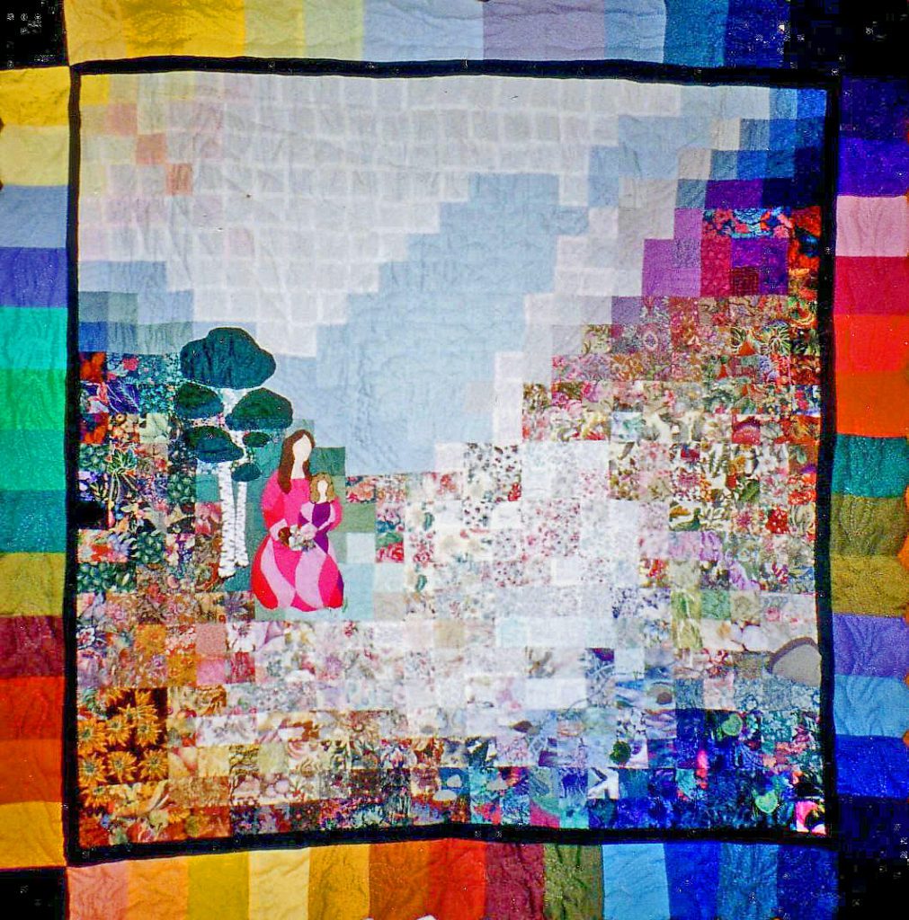 Watercolour quilt of a mother and daughter against a multi hued background of squares