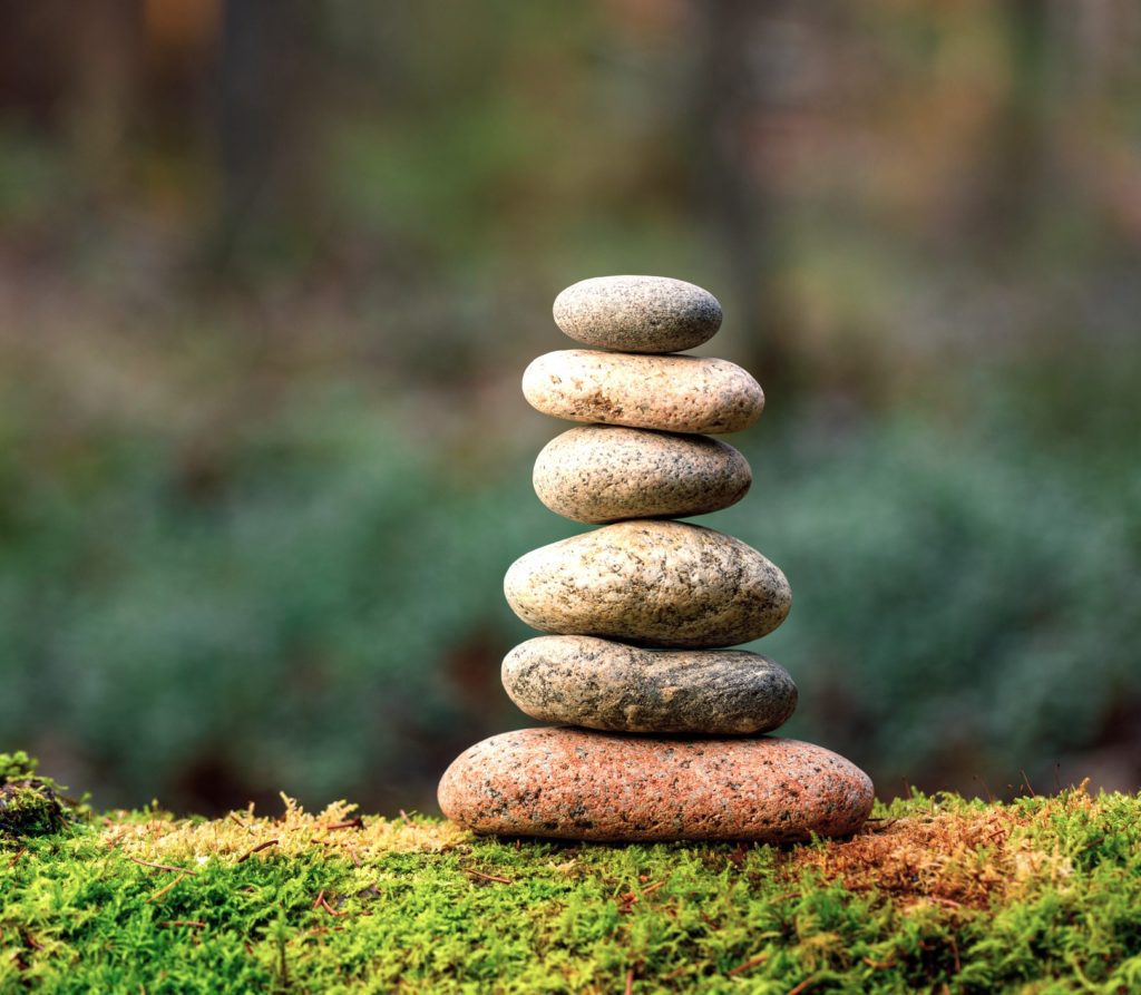 Stone cairn on mossy ground