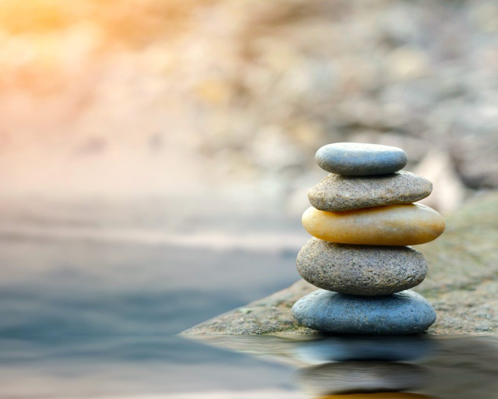 Stone cairn against a softly lit background