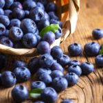 Blueberries spilling out of a basket