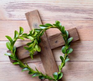 Rustic cross with an olive leaf heart