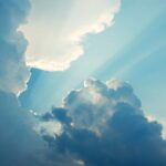 Rays of sunshine bursting through a cloudy sky