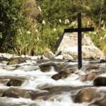 Cross beside a stream