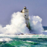 Lighthouse against the waves