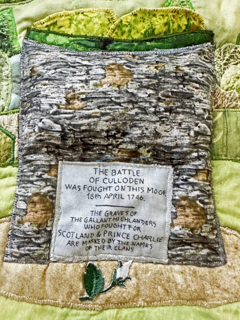 Culloden Quilt - a white rose at the foot of the Memorial Cairn.