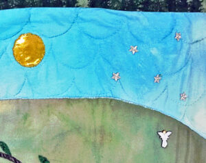 Gold sun with silver starts part of a Tree of Life Quilt