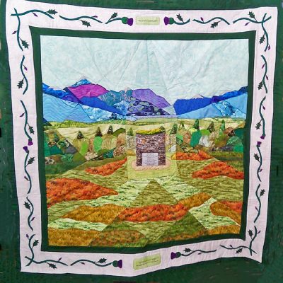 Quilt depicting the Memorial Cairn on the battlefield of Culloden
