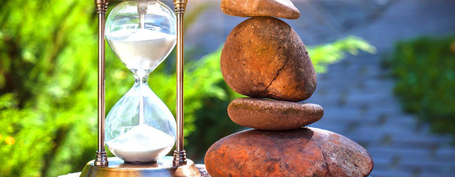 Hourglass and stone cairn